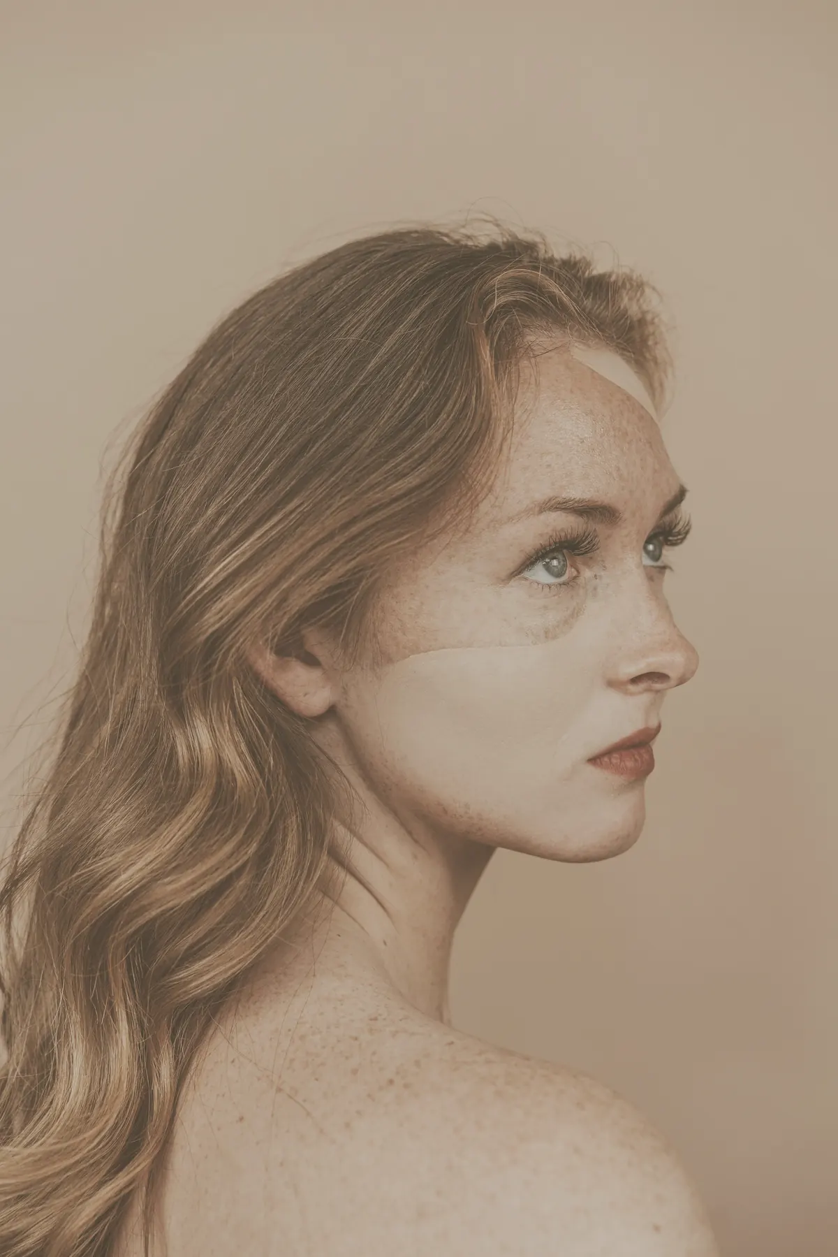 A woman in soft light, her face in profile